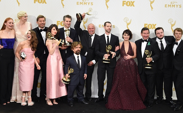 (L-R) Actors Sophie Turner, Gwendoline Christie, Maisie Williams, Nikolaj Coster-Waldau, Carice van Houten, writer/director David Benioff, actors Peter Dinklage, Conleth Hill, writer/director D.B. Weiss, actress Lena Headey, director David Nutter, actors John Bradley and, Alfie Allen winners of the award for Outstanding Drama Series for 'Game of Thrones' pose in the Press Room during the 67th Emmy Awards on September 20, 2015 at the Microsoft Theater in Los Angeles, California. AFP PHOTO / VALERIE MACONVALIERE MACON/AFP/Getty Images